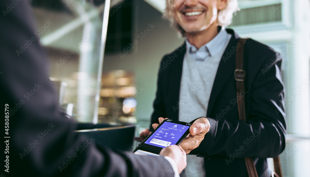 Man showing flight ticket to staff on phone