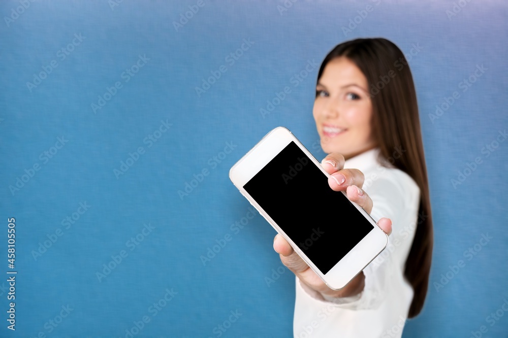 Young girl show empty smartphone with positive expression,