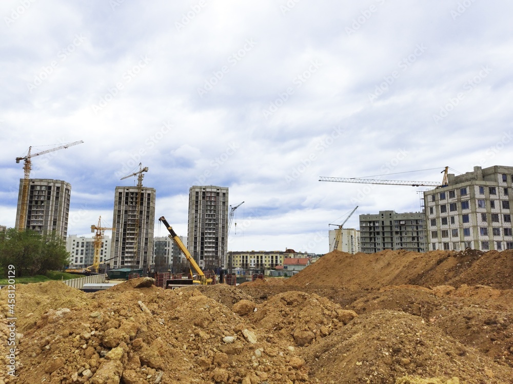 The architectural complex of residential buildings on sky background