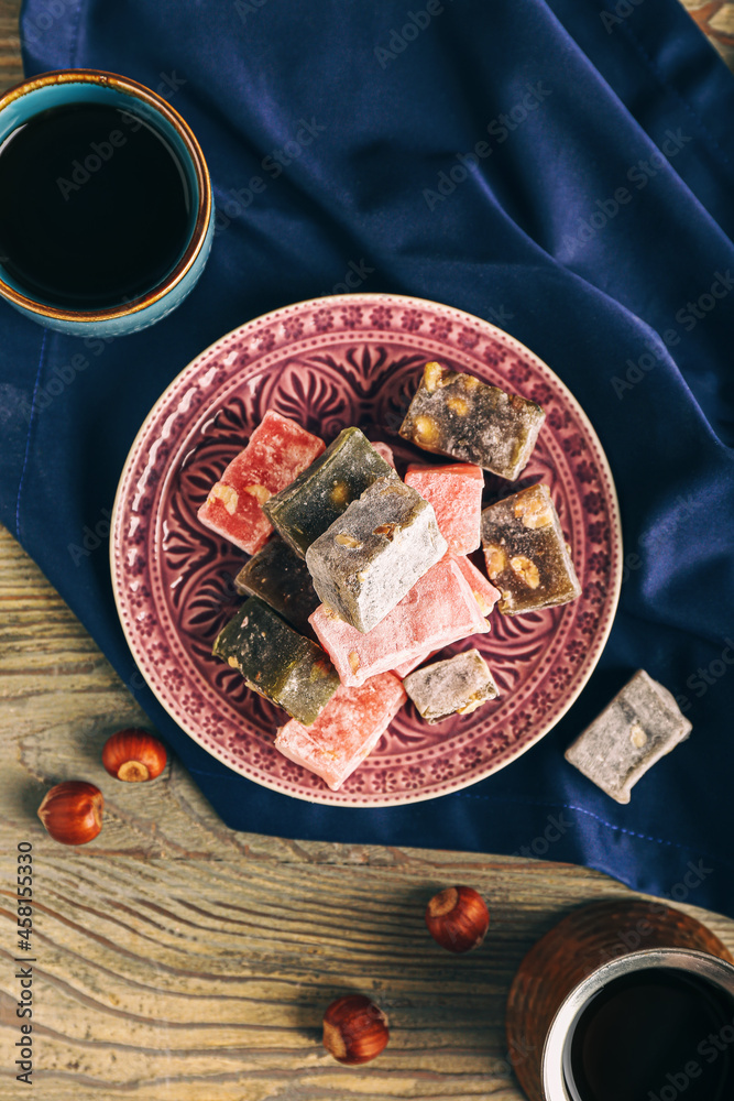 Composition with tasty Turkish delight on wooden background