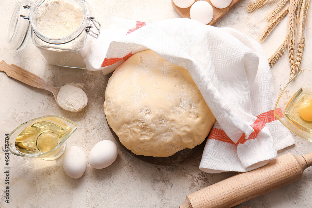 Composition with fresh dough on light background