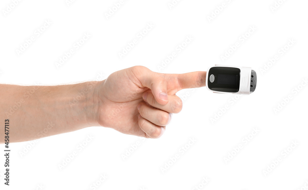 Hand of young man with pulse oximeter on white background