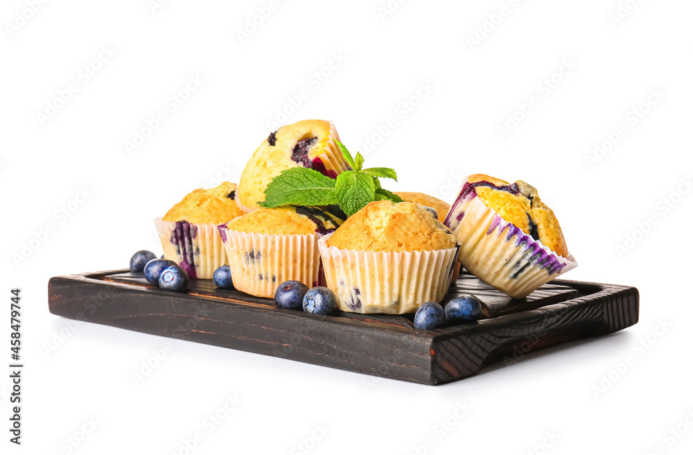 Board with tasty blueberry muffins on white background