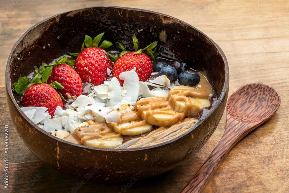 Fruit bowl with fresh sliced fruit.