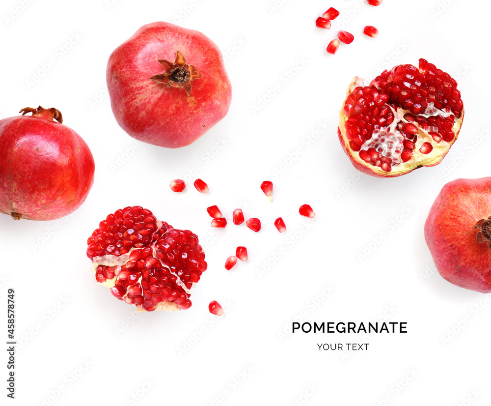 Creative layout made of pomegranate on the white background. Flat lay. Food concept. Macro concept.