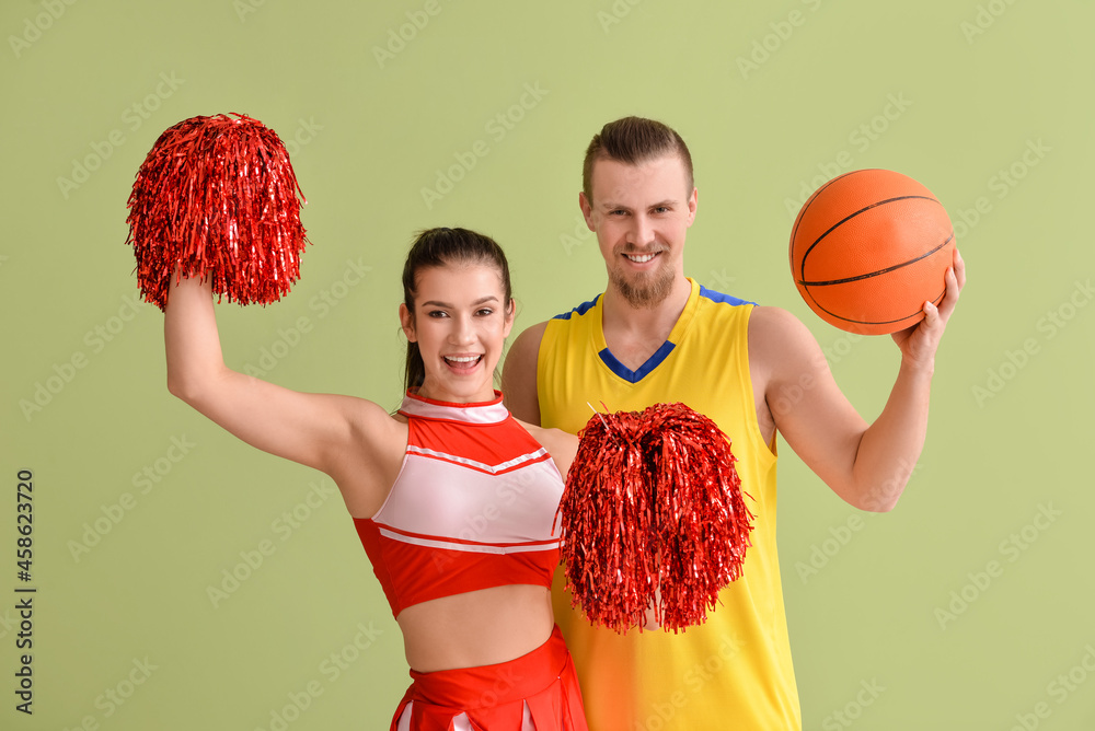 Cheerleader and basketball player on color background