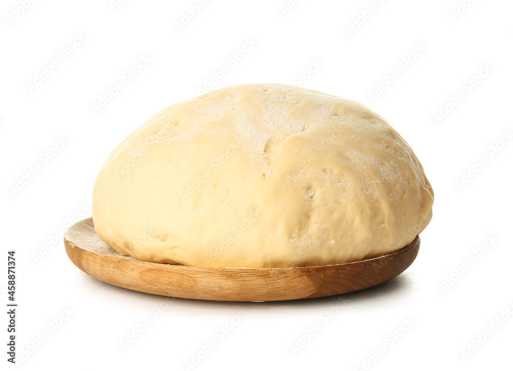 Wooden board with fresh dough on white background