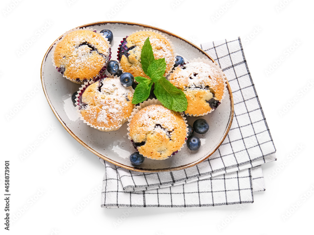 Plate with tasty blueberry muffins on white background