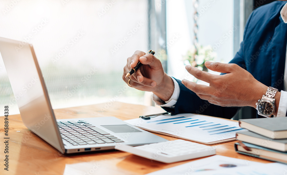 Close up of accountant or banker checking investment results, calculates financial savings, calculat