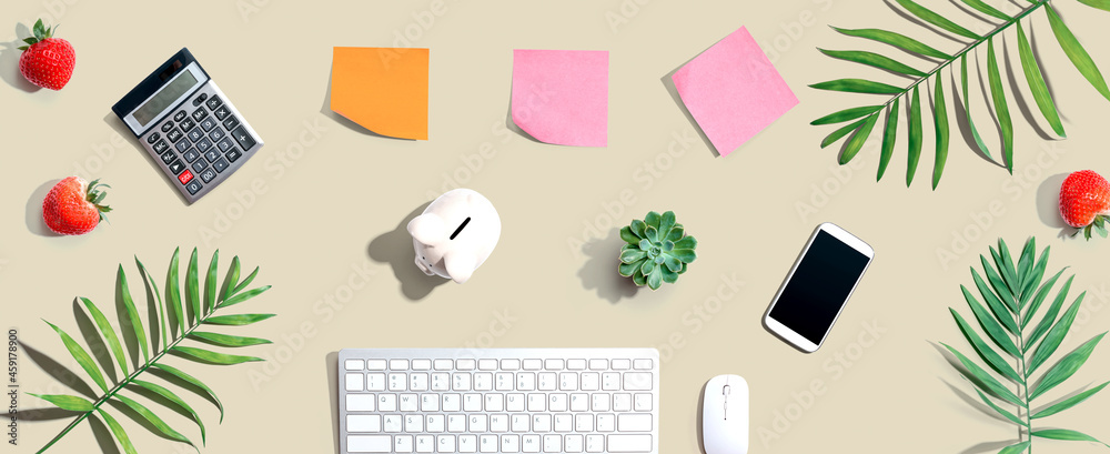 Computer keyboard with office supplies - flat lay