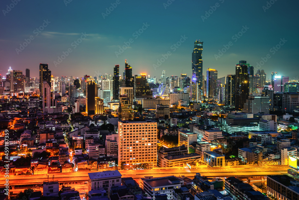 Night cityscape and high-rise buildings in metropolis city center . Downtown business district in pa