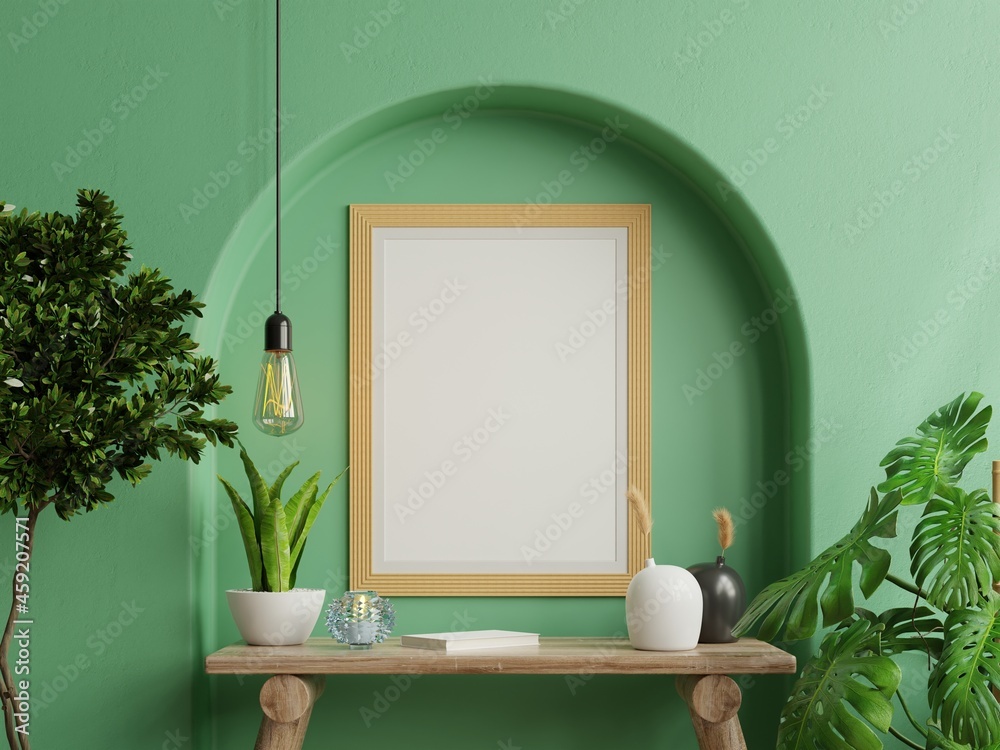 Mock up photo frame green wall mounted on the wooden shelf with beautiful plants.