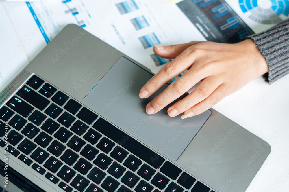 Close up of businessman or accountant working on laptop computer for calculate business data, accoun