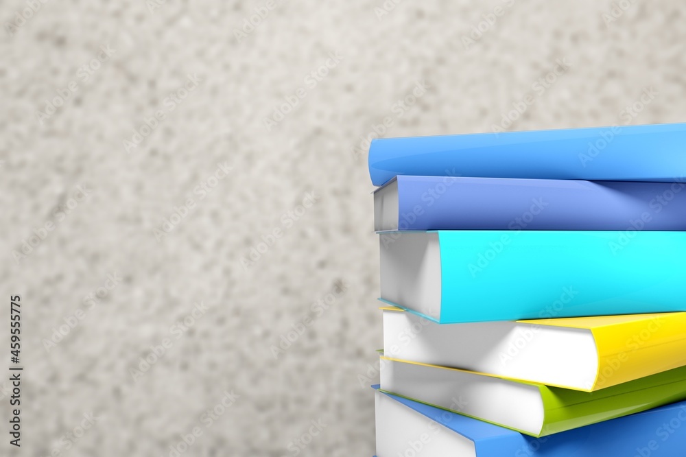 Stack of colored study books on a background in a bookstore