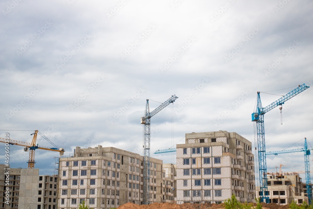 The architectural complex of residential buildings on sky background