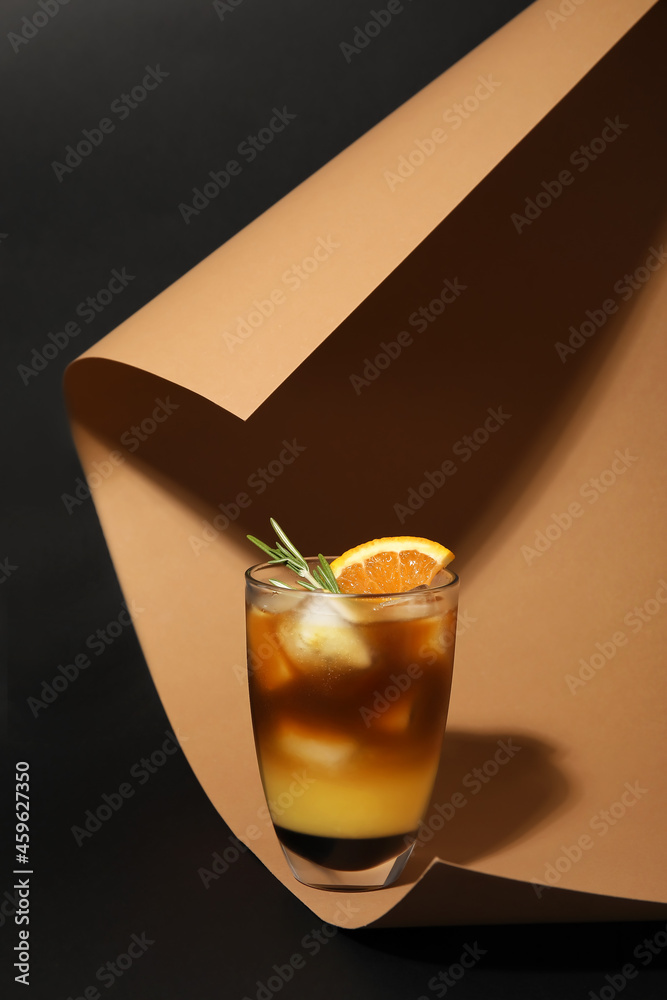 Glass of tasty coffee with orange juice on color background