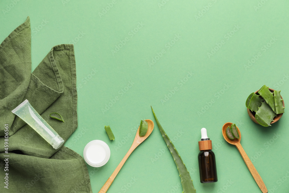 Different cosmetic products with aloe on color background