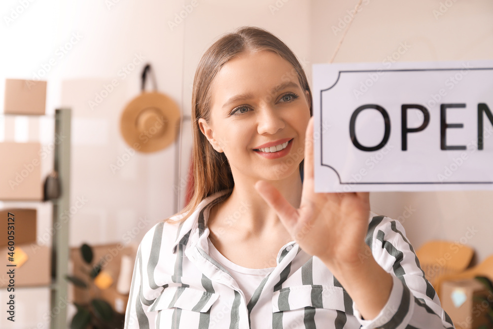 Female business owner opening her shop