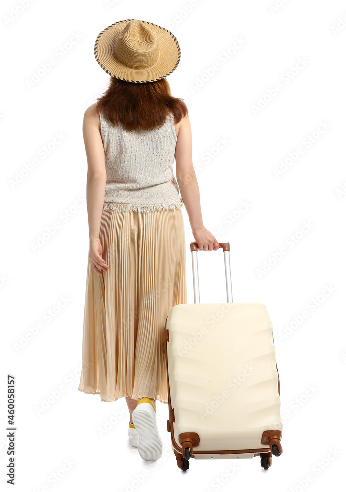 Young woman with suitcase on white background