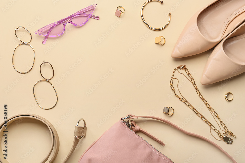 Frame made of stylish accessories on color background