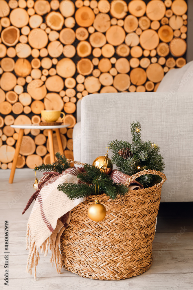 Basket with Christmas decor in room