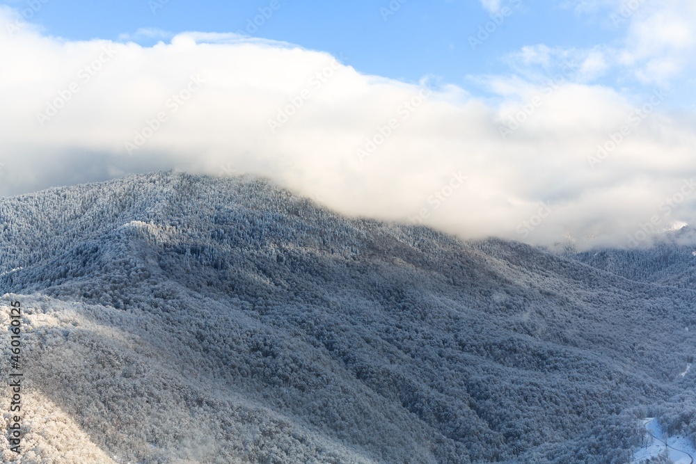 Winter snow covered mountain peaks in Caucasus. Great place for winter sports