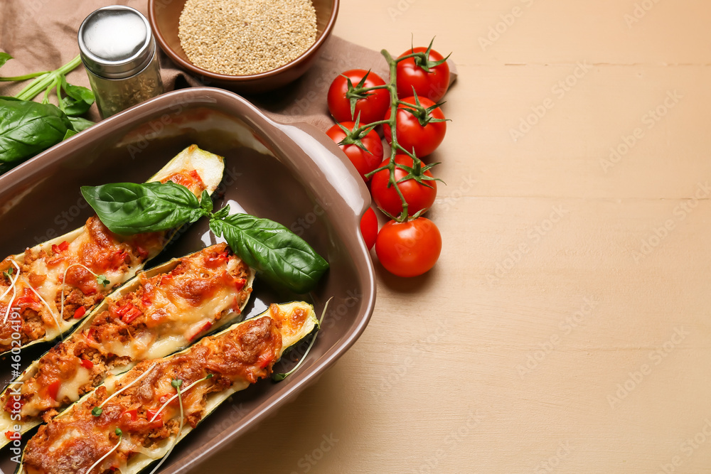 Composition with meat stuffed zucchini boats on color wooden background