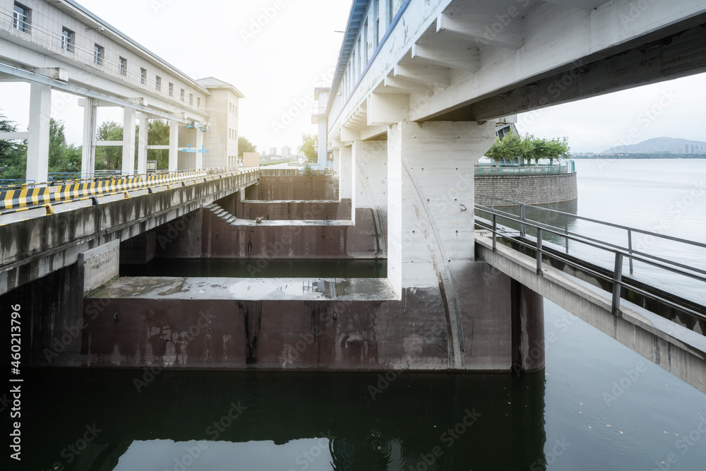 The water flows through the open sluice of the reservoir.