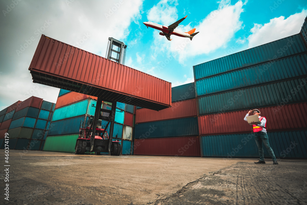 Cargo container for overseas shipping in shipyard with airplane in the sky . Logistics supply chain 