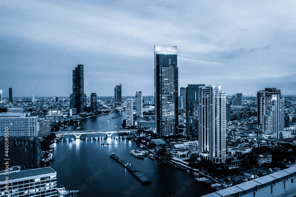 Blue-filtered cityscape and high-rise buildings in metropolis city center . Downtown business distri