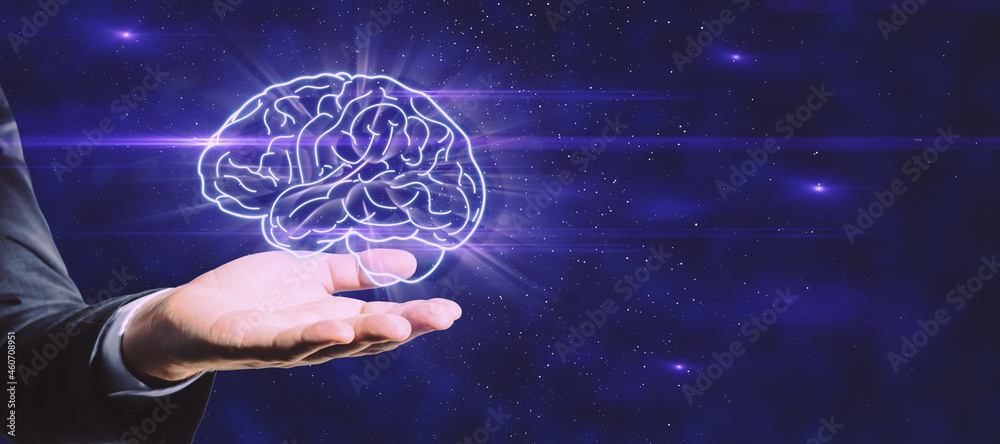 Close up of hand holding glowing human brain on dark blue background with mock up place. Artificial 