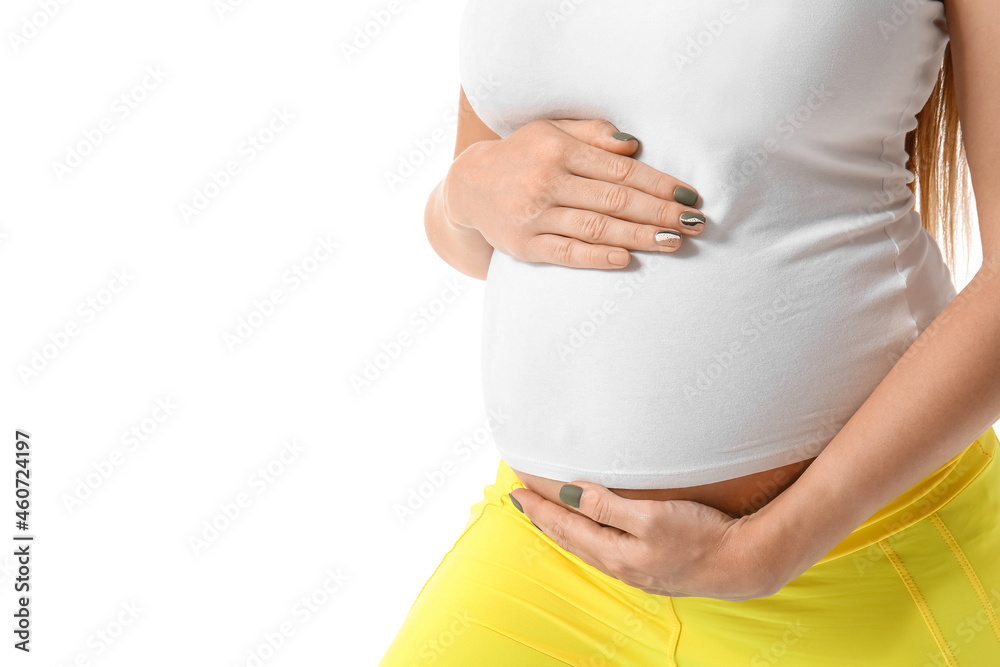 Young pregnant woman doing yoga on white background, closeup