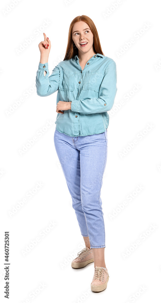 Thoughtful young woman with raised index finger on white background