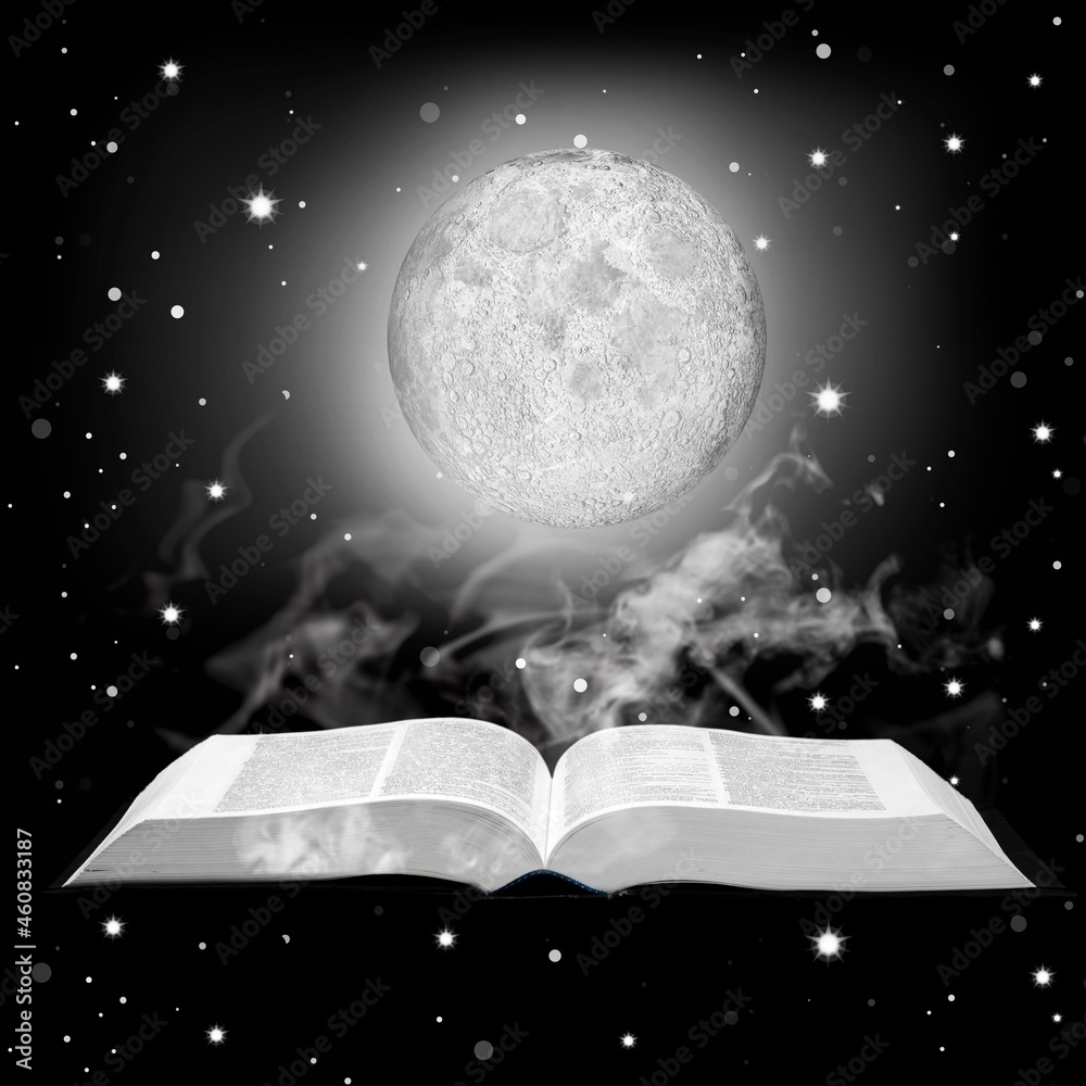 Full moon above open pages of old book; Astrology, zodiac, esoteric background concept