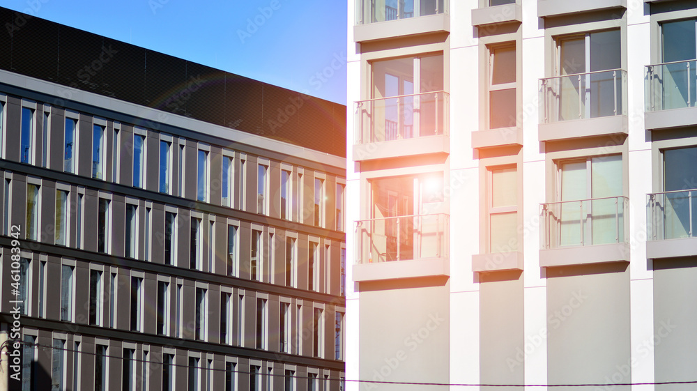 Modern apartment building. Modern urban architecture and details of building facade. Sunlight.