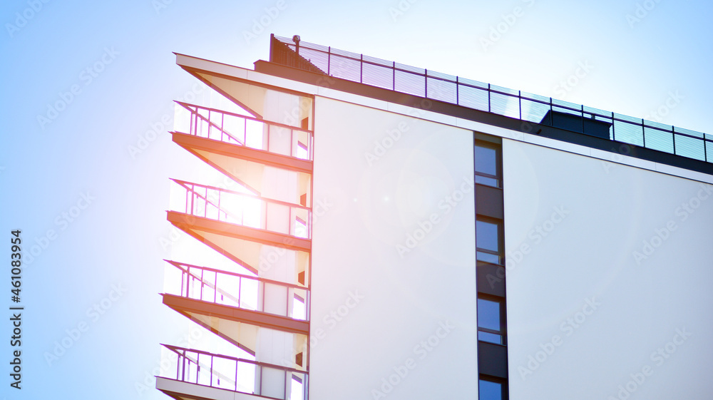 Modern apartment building. Modern urban architecture and details of building facade. Sunlight.