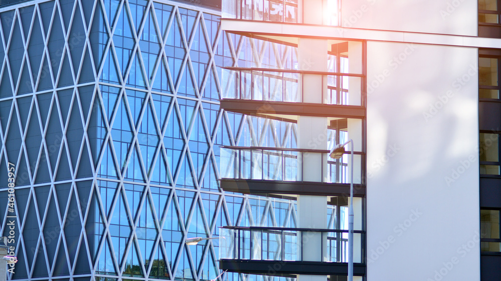 Modern apartment building. Modern urban architecture and details of building facade. Sunlight.