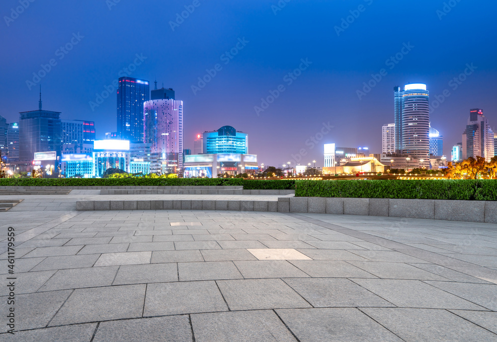 empty brick floor with city skyline background