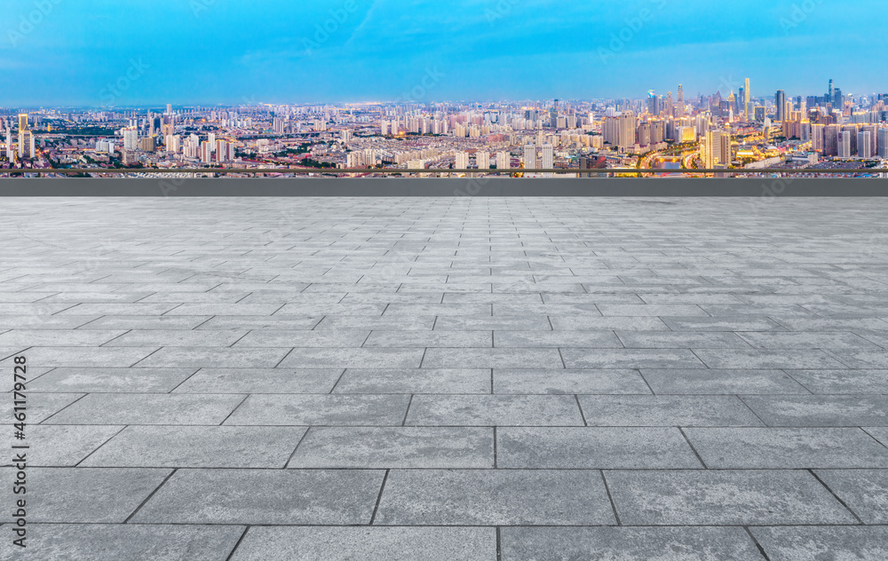 empty brick floor with city skyline background