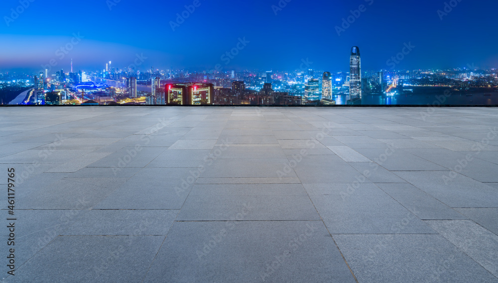 empty brick floor with city skyline background