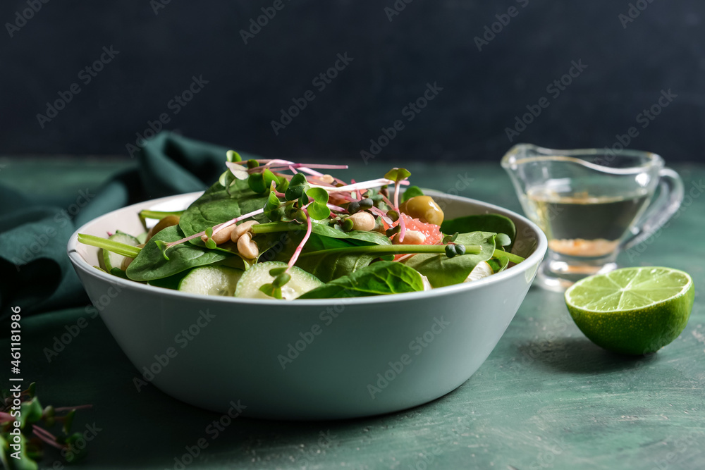 Plate with healthy salad on color background