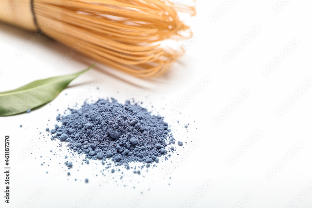 Heap of powdered blue matcha tea isolated on white background, closeup