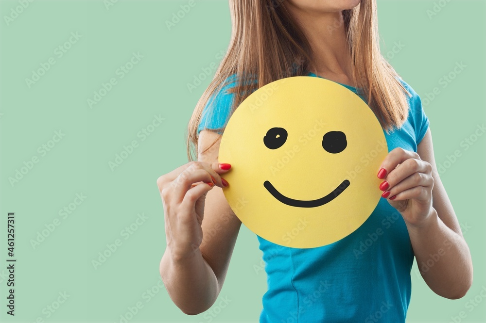 Hands holding happy smile face, good feedback rating and positive customer review,