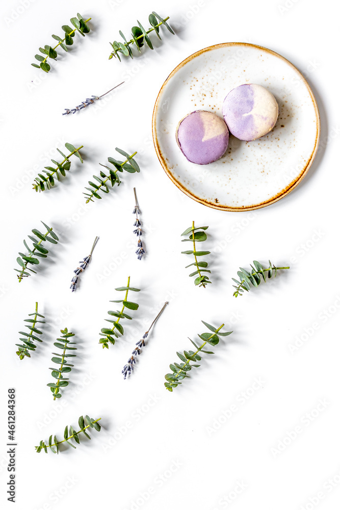 woman breakfast with lavander and eucalyptus on white table top view