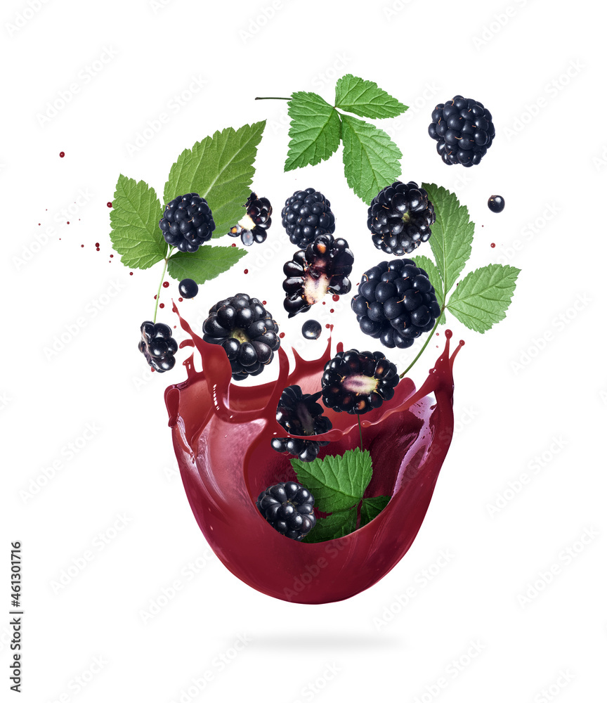 Ripe blackberry with leaves in splashes of fresh juice, isolated on white background