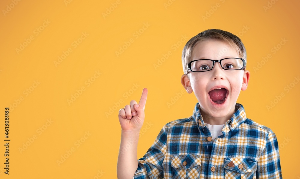 Cheerful happy little kid smiling and and looking at camera