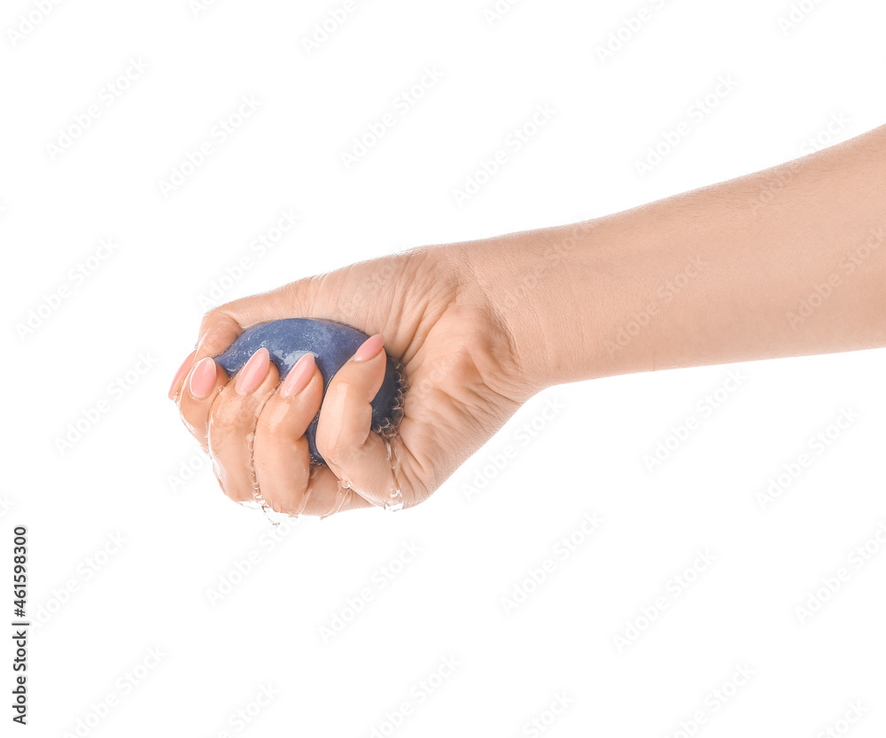 Woman squeezing wet makeup sponge on white background