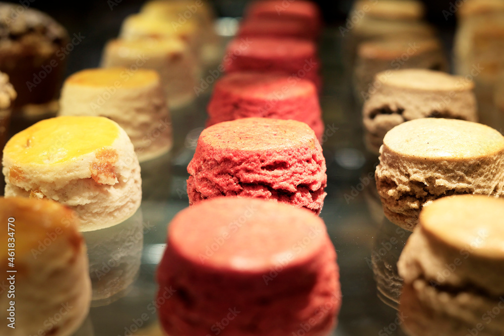 assortment of cup cake and macaron sold in bakery