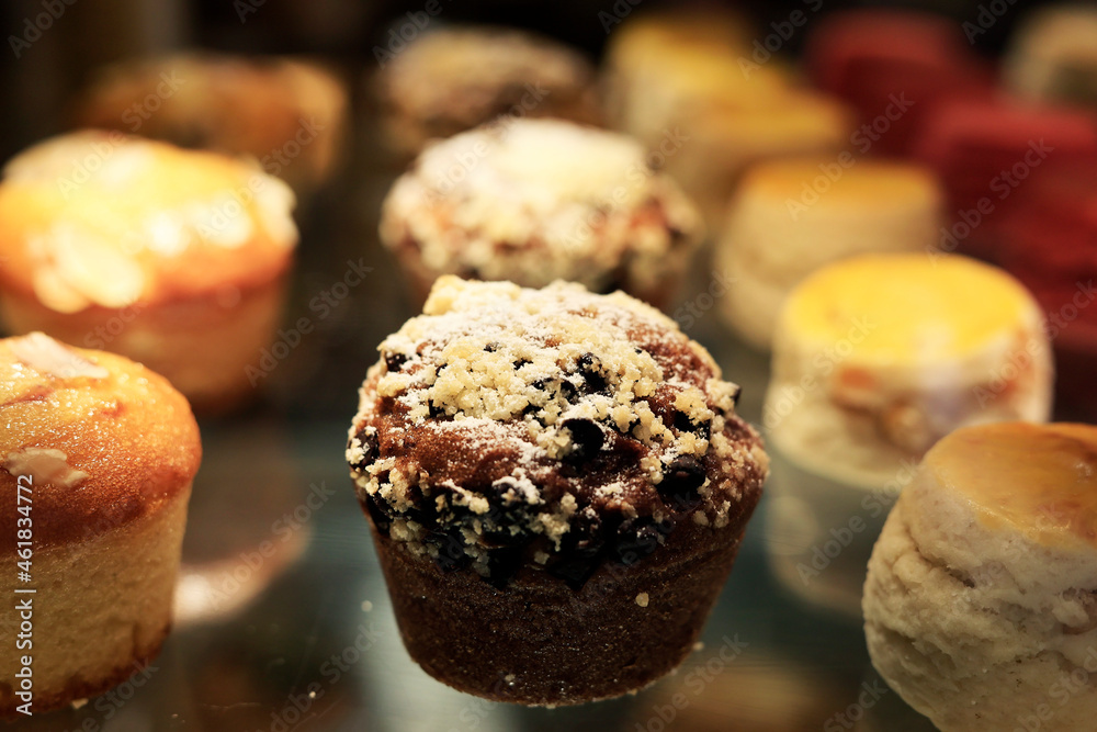 assortment of cup cake and macaron sold in bakery