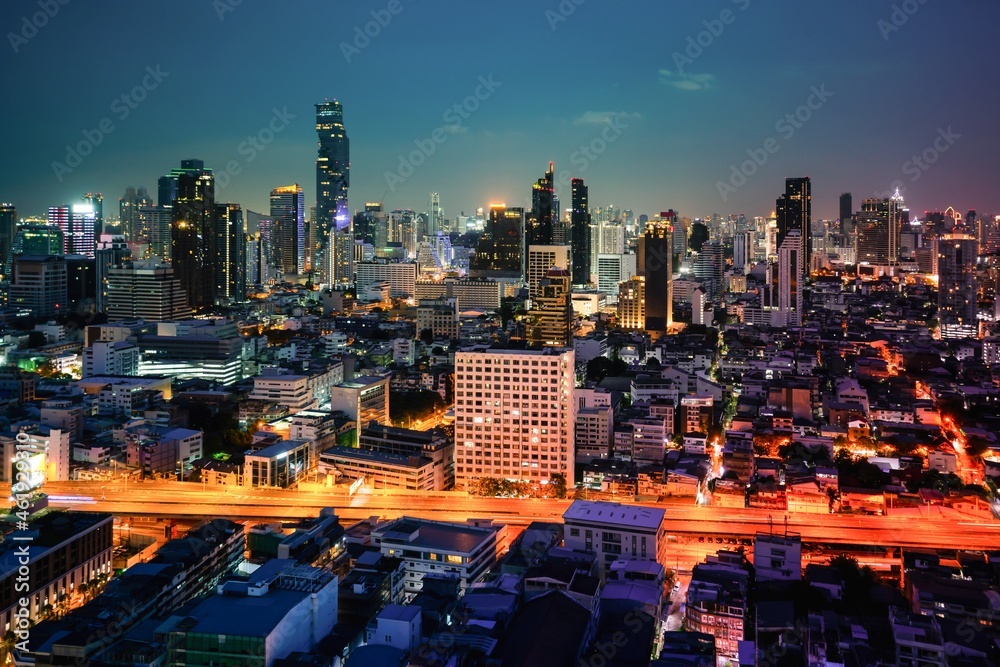 Night cityscape and high-rise buildings in metropolis city center . Downtown business district in pa